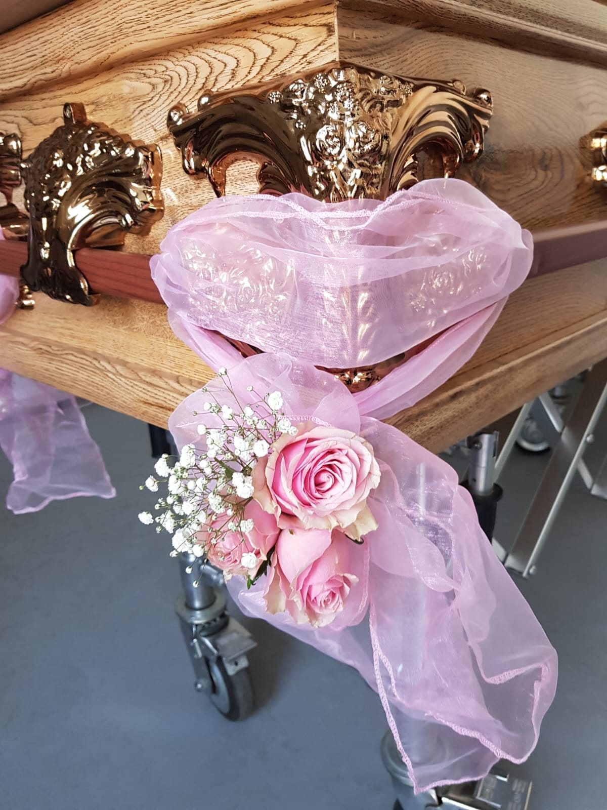 Coffin with floral arrangement